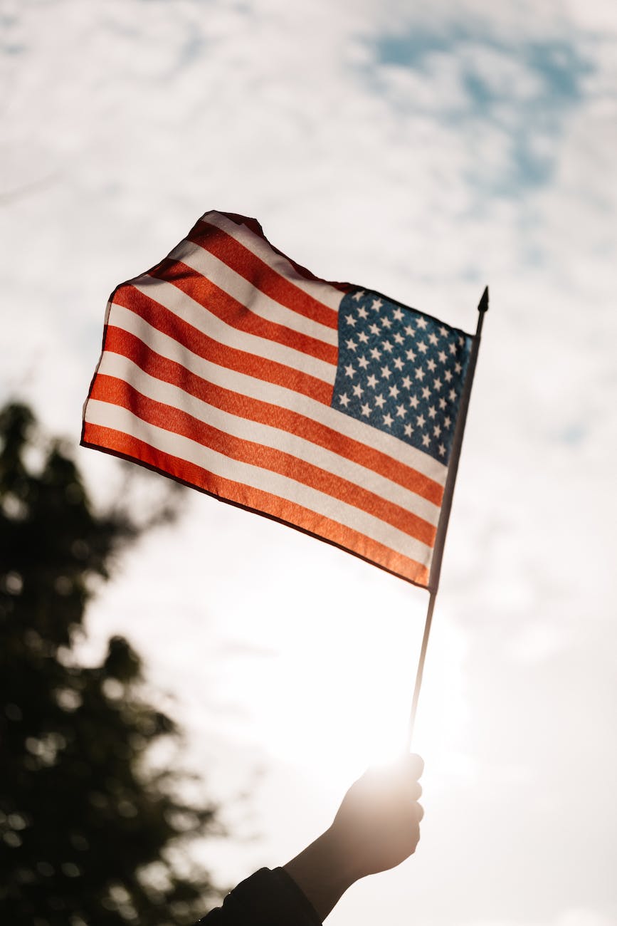 crop unrecognizable patriot celebrating memorial day showing american flag - tunnel vision on the presidential aspect