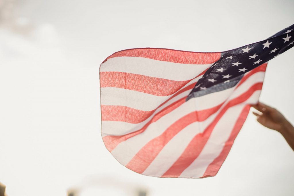 person holding an american flag