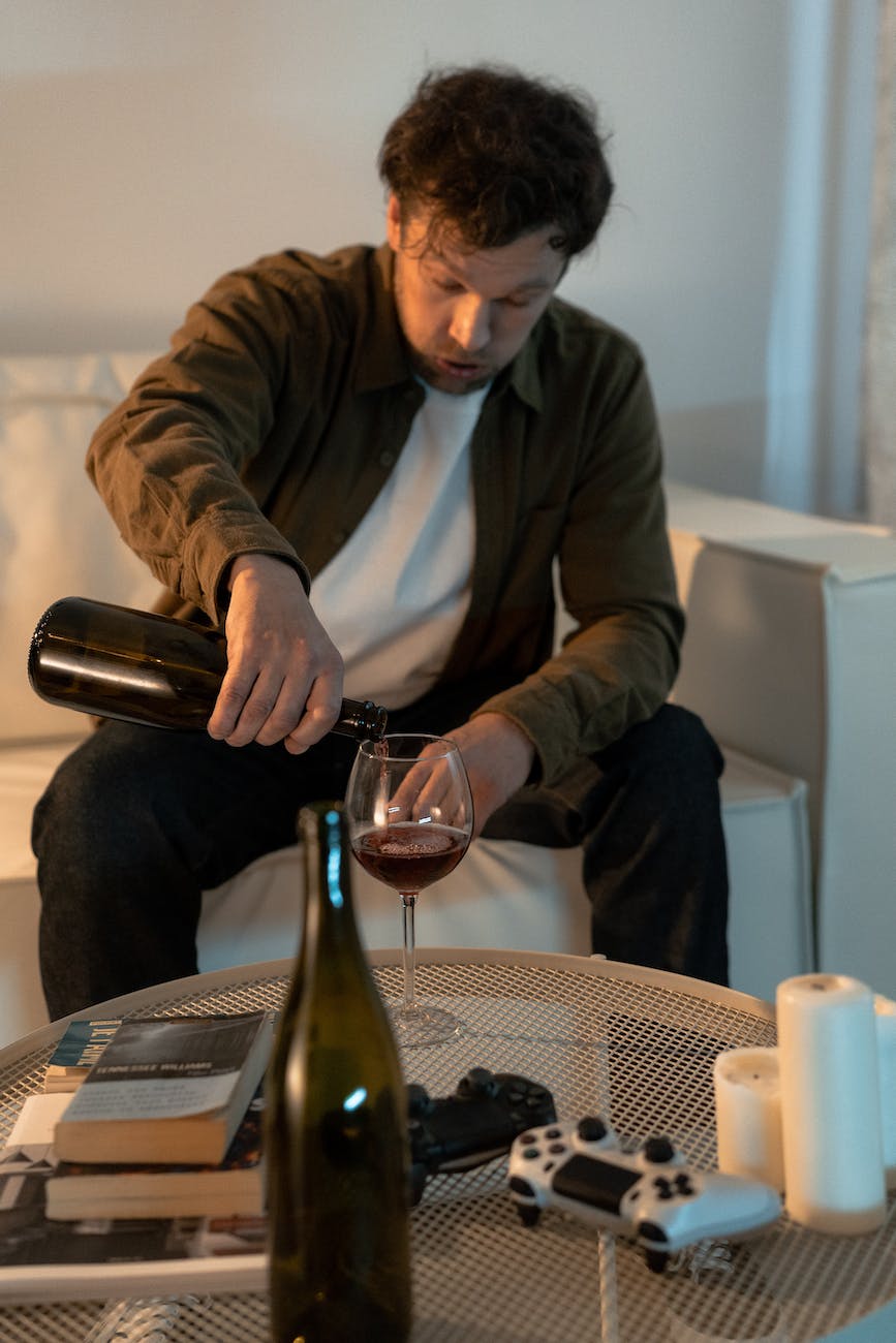 a man drinking wine at home